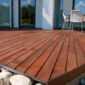 best decking material close up of a new deck after being installed just off a home 85x85