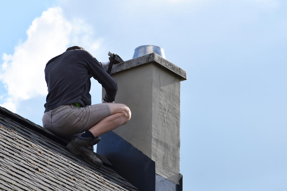 roof flashing-chimney flashing being repaired on a shingle roof