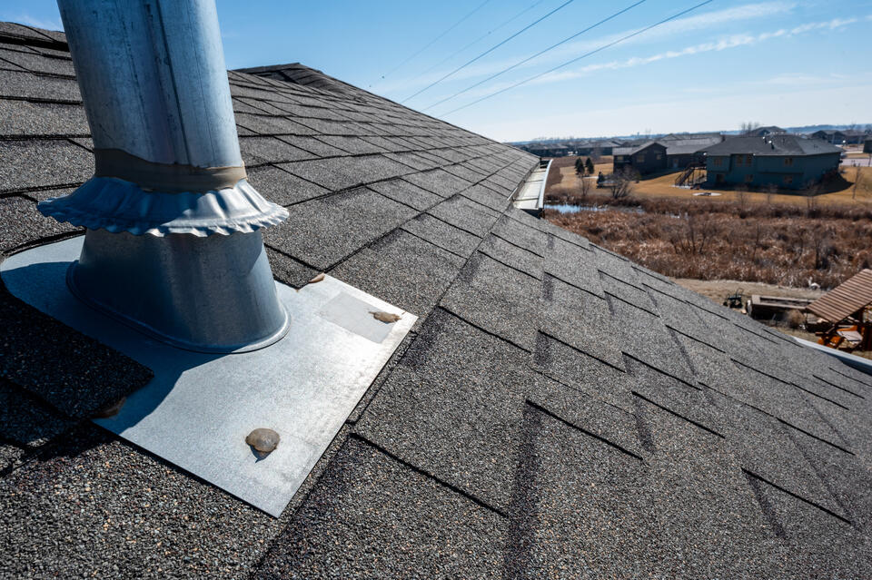 roof flashing-close up of boot flashing around a pipe on a roof